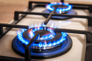 closeup of blue flames, stove burners