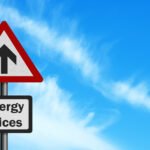 sign showing "Energy Prices" rising (upward arrow)
