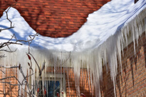 ice buildup on roof and in gutters - ice dam