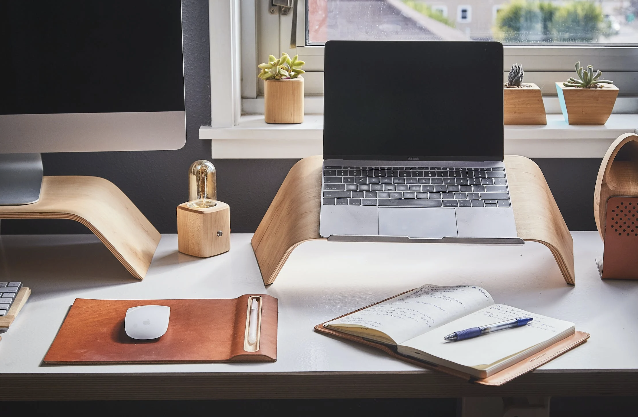 laptop, notebook and pen