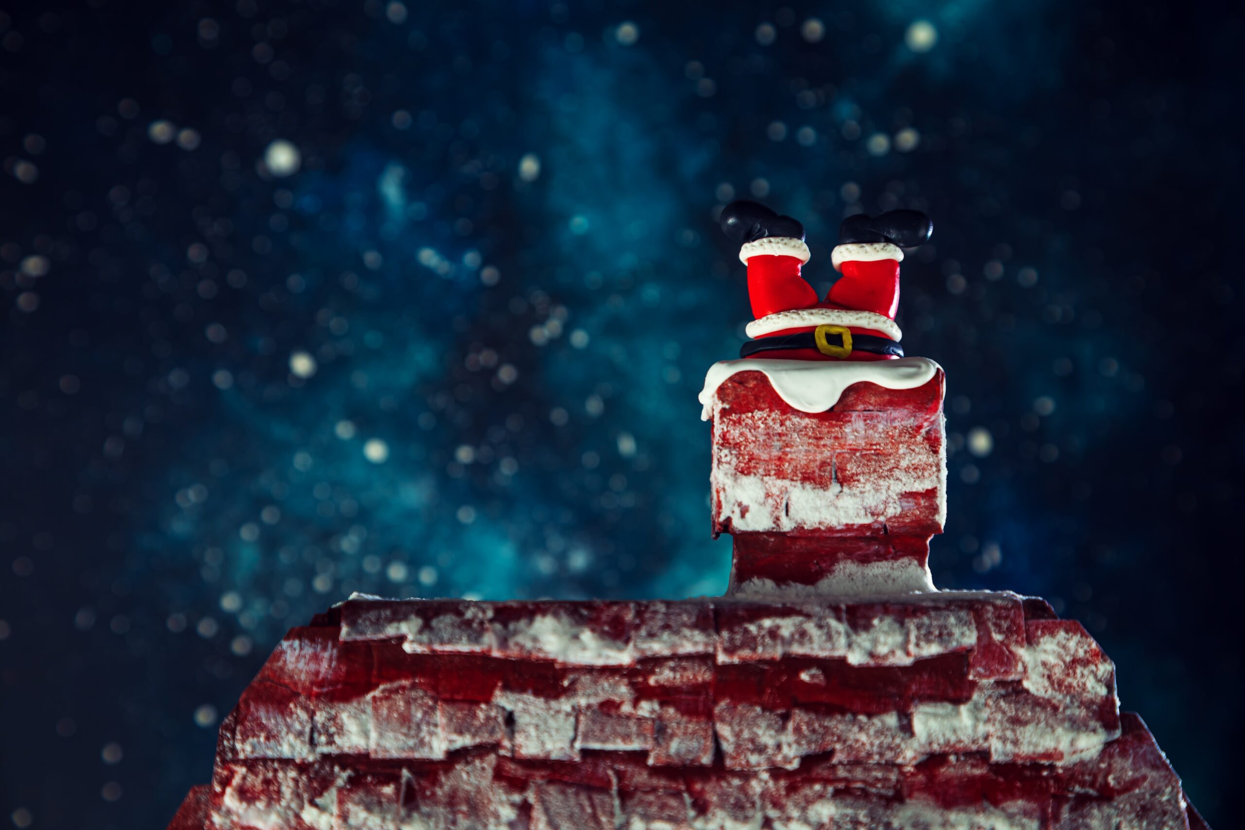 Santa's legs sticking out from a chimney